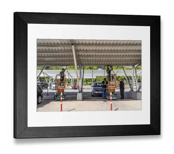 Framed Print : Construction of a carport photovoltaic system