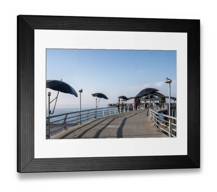 Framed Print : Pier with modern parasols and sea views