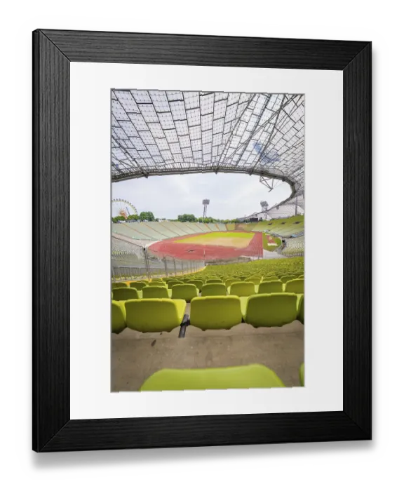 Framed Print : Empty modern stadium with central view of running track and striking glass architecture