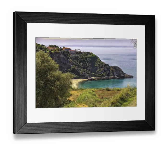 Framed Print : Coastal landscape with steep cliffs and blue sea
