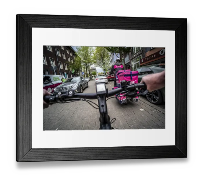 Framed Print : Cycling in the city, inner-city street