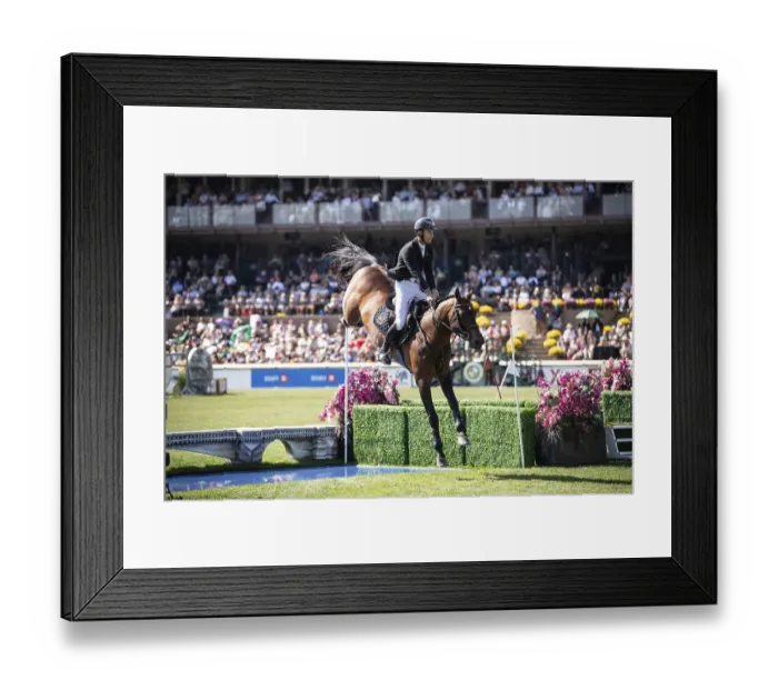 Framed Print : Richard Vogel of Germany and riding United Touchs compete in the first round of the 1