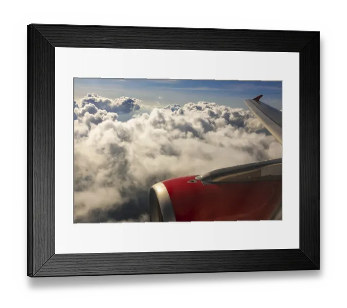 Framed Print : A colour landscape image looking out through airplane window showing land
