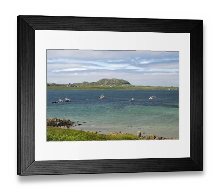 Framed Print : Sea view with several boats and a rocky coastline under a slightly cloudy sky Framed Print : Sea view with several boats and a rocky coastline under a slightly cloudy sky