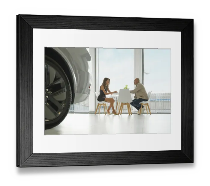 Framed Print : Inside a bright car dealership