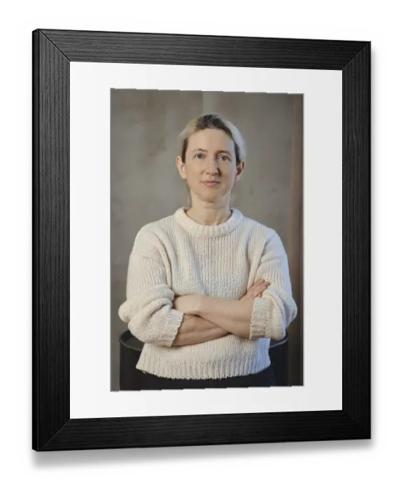 Framed Print : A woman poses confidently with her arms crossed Framed Print : A woman poses confidently with her arms crossed