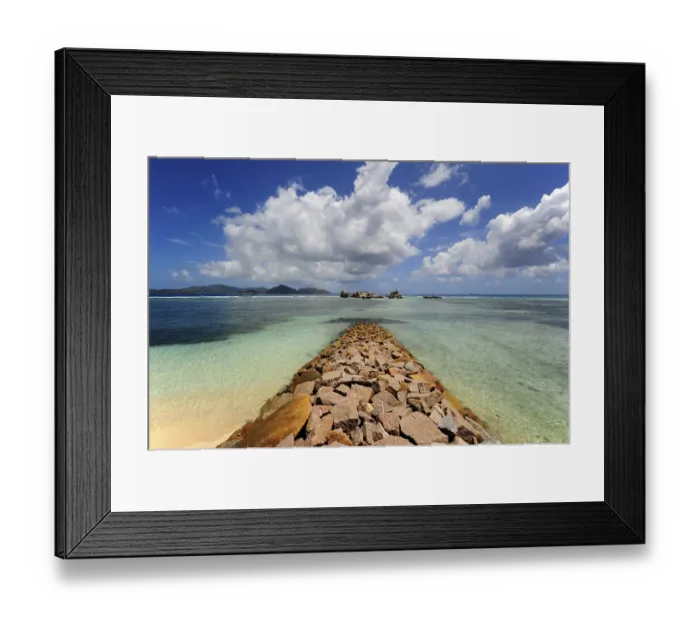 Framed Print : Breakwater in front of the harbour of La Passe Framed Print : Breakwater in front of the harbour of La Passe