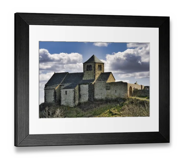 Framed Print : Dauzat-sur-Vodable. The Romanesque church of Saint-Geraud built on a basalt peak Framed Print : Dauzat-sur-Vodable. The Romanesque church of Saint-Geraud built on a basalt peak