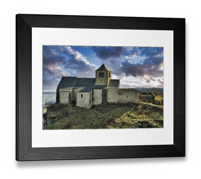 Framed Print : Dauzat-sur-Vodable. The Romanesque church of Saint-Geraud built on a basalt peak Framed Print : Dauzat-sur-Vodable. The Romanesque church of Saint-Geraud built on a basalt peak
