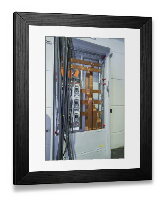 Framed Print : Open cable cabinet with visible copper rods and power cables