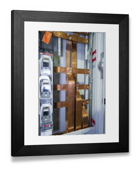 Framed Print : Detailed view of copper rods in an industrial cable cabinet