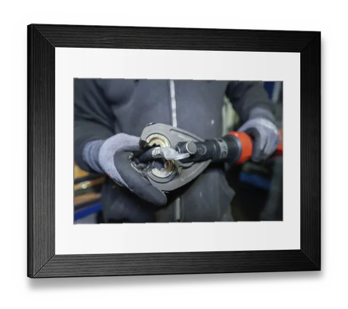 Framed Print : Mould presses a cable in a technical environment