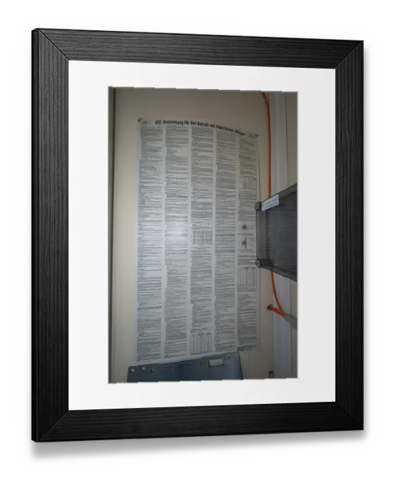 Framed Print : An extensive poster with regulations for the operation of electrical systems is attached to a wall Framed Print : An extensive poster with regulations for the operation of electrical systems is attached to a wall