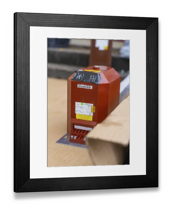 Framed Print : Red box with technical labels on a cardboard base Framed Print : Red box with technical labels on a cardboard base