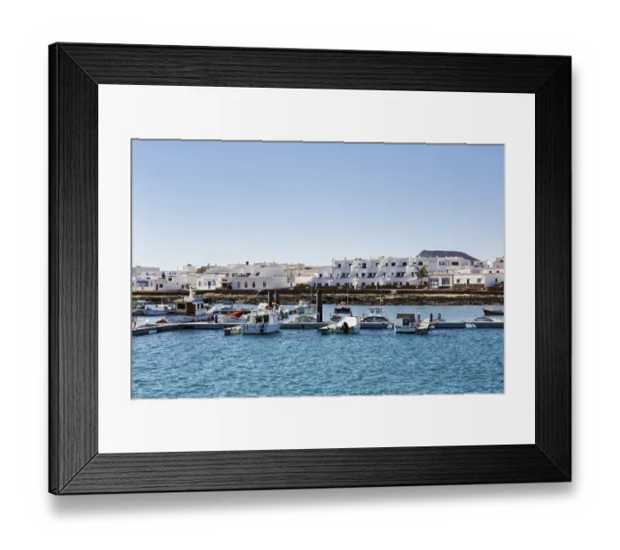 Framed Print : Boats in the harbour, white houses