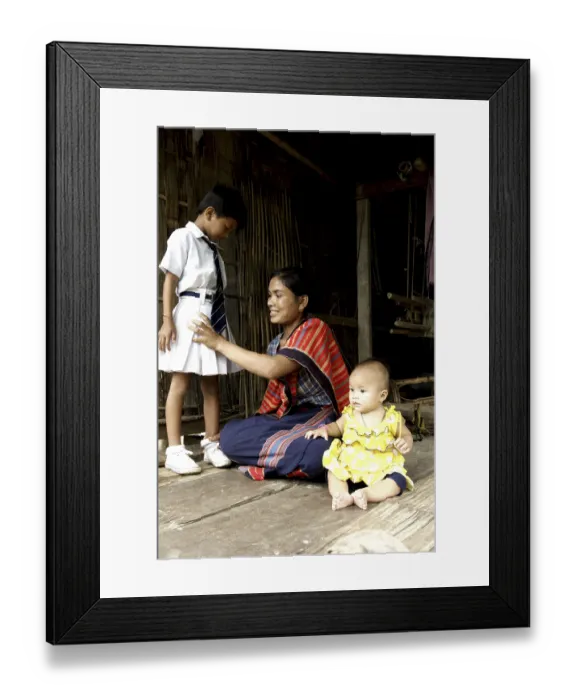 Framed Print : Woman making her child ready for school