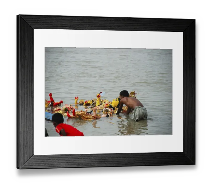 Framed Print : Devotees immersing Durga model in river Framed Print : Devotees immersing Durga model in river