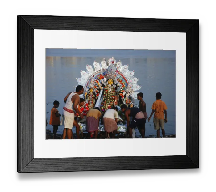 Framed Print : Devotees immersing Durga model in river Framed Print : Devotees immersing Durga model in river