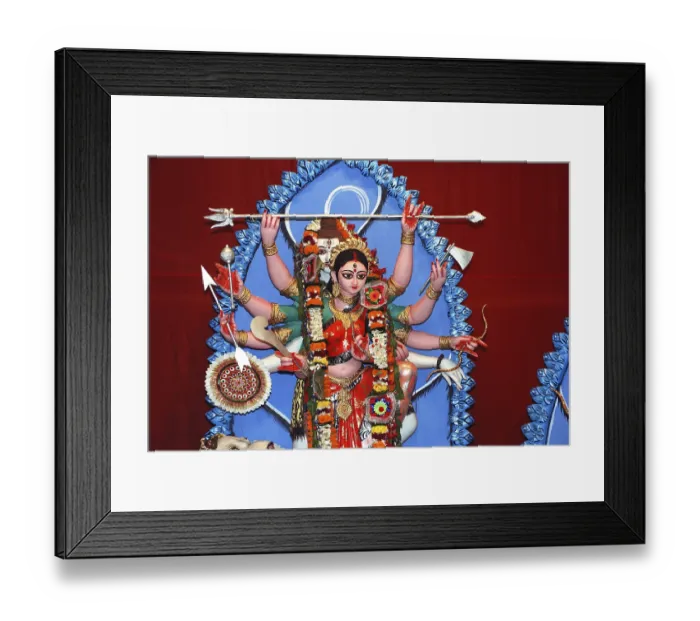 Framed Print : Durga clay model holding weapons and god shiva in background on Durga puja Framed Print : Durga clay model holding weapons and god shiva in background on Durga puja