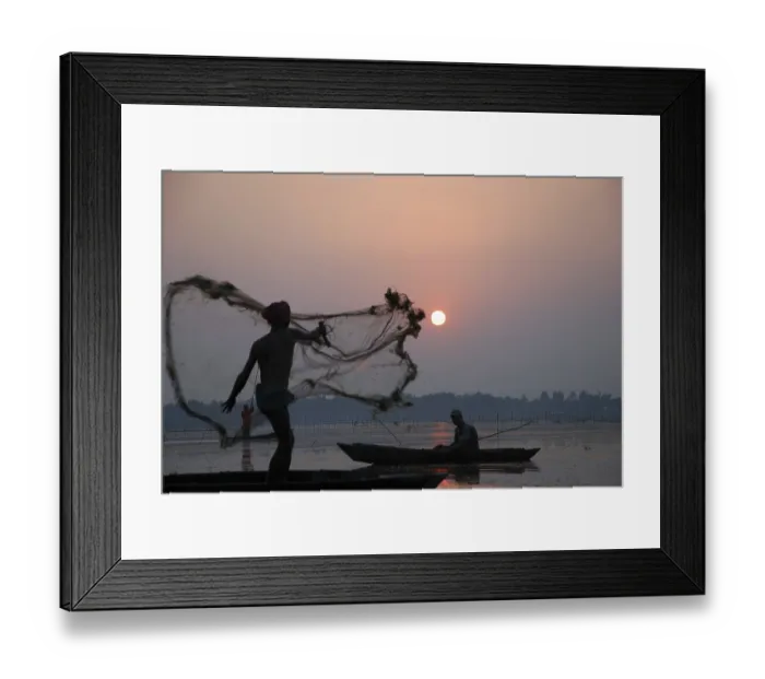 Framed Print : Fisherman in boat throwing net in silhouette Framed Print : Fisherman in boat throwing net in silhouette