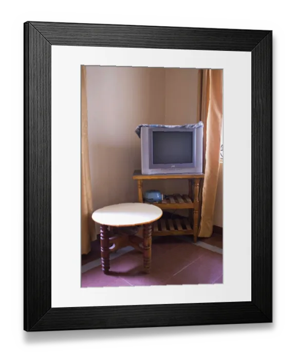 Framed Print : Interior of hotel with television and table Framed Print : Interior of hotel with television and table