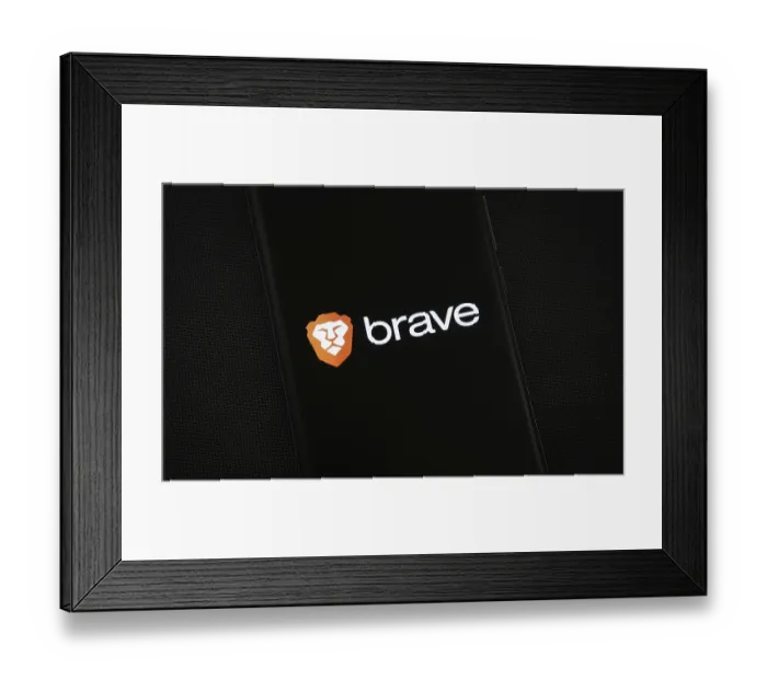 Framed Print : Brave logo is displayed on a smartphone screen Framed Print : Brave logo is displayed on a smartphone screen