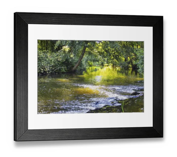 Framed Print : A calm river with rapids, surrounded by trees Framed Print : A calm river with rapids, surrounded by trees