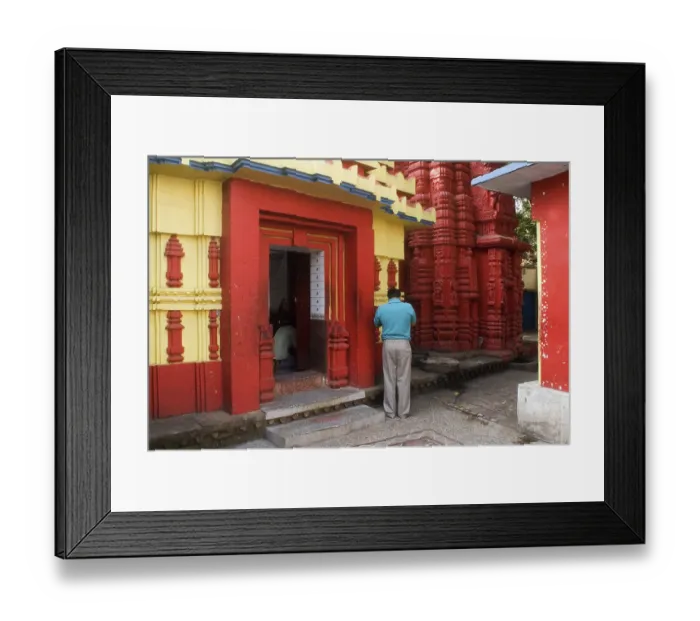 Framed Print : Devotee at 11th century Brahmeshwar temple dedicated to the lord Shiva considered prime example of Orissan architecture