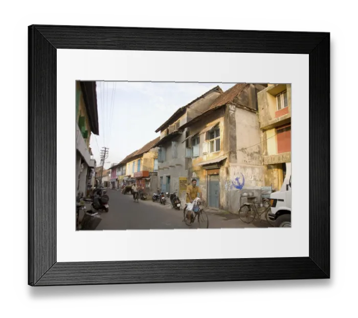 Framed Print : Street scene man riding bicycle Framed Print : Street scene man riding bicycle