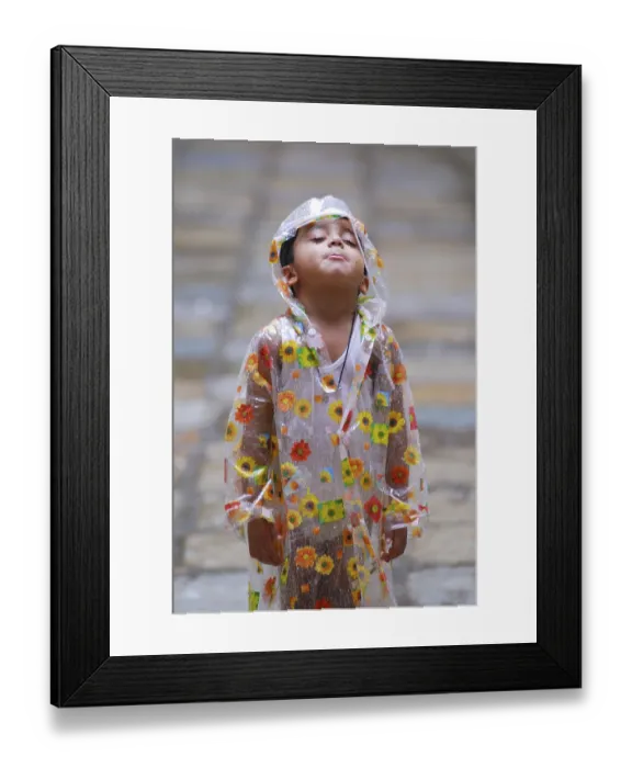 Framed Print : Boy wearing raincoat, India Framed Print : Boy wearing raincoat, India