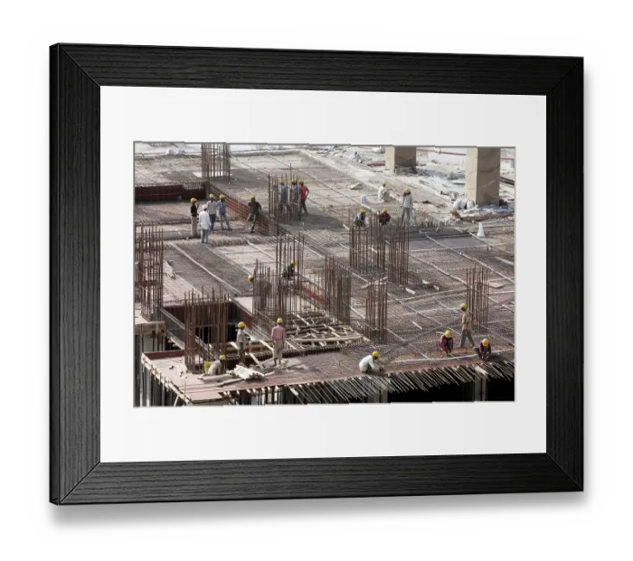 Framed Print : Workers working on the site of buildings being constructed on the site of earlier Jupiter mills