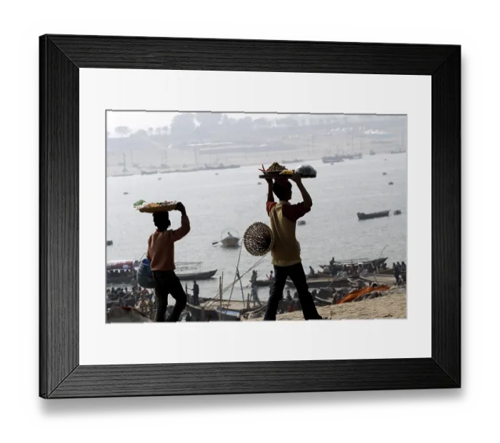 Framed Print : A hawker sells eatables at the confluence of the Ganges