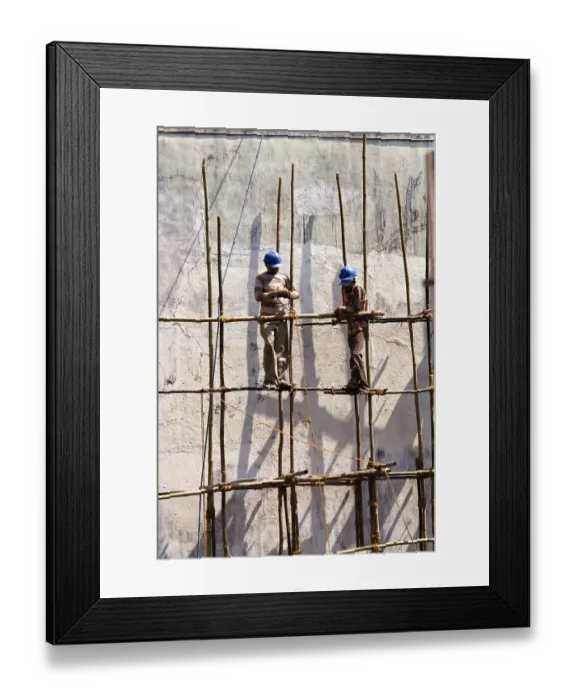 Framed Print : Construction workers tying bamboos with rope