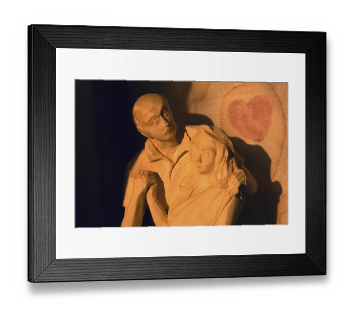 Framed Print : Sunbeam on statue of couple in romantic pose sculpted with plaster of paris Framed Print : Sunbeam on statue of couple in romantic pose sculpted with plaster of paris