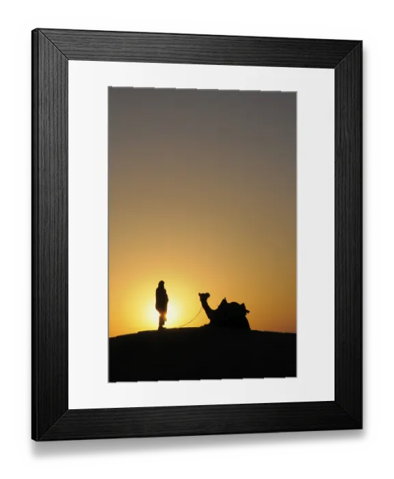 Framed Print : Glorious sunrise man with camel on sand dunes