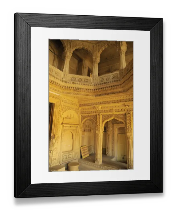 Framed Print : Several beautifully carved arch doors made by sandstones inside temple at Amarsagar Lake
