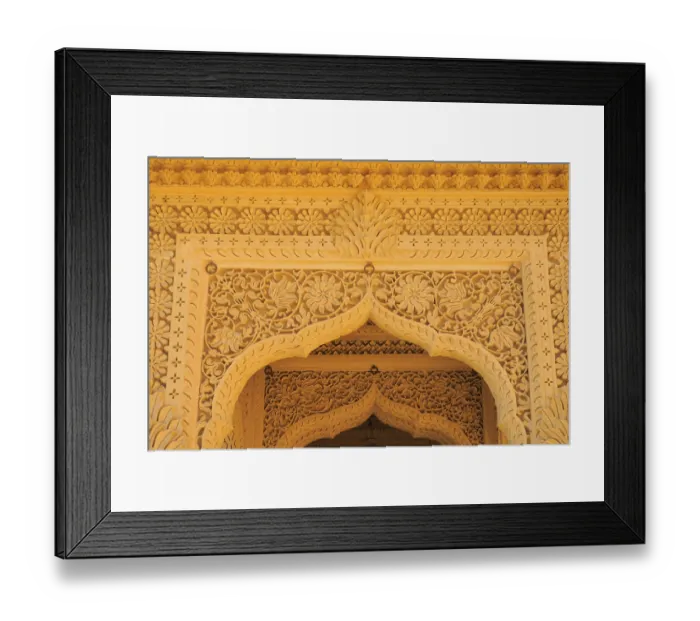 Framed Print : Beautifully carved top of arch door made by sandstones in temple at Amarsagar Lake