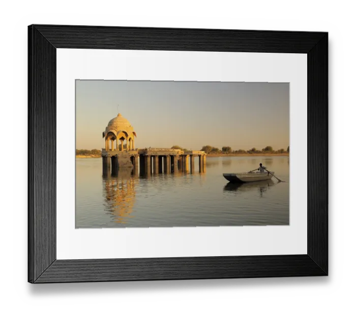 Framed Print : Cenotaph called chhatri and pillars reflection and rowing boat in waters of Gadsisar or Gadisar lake