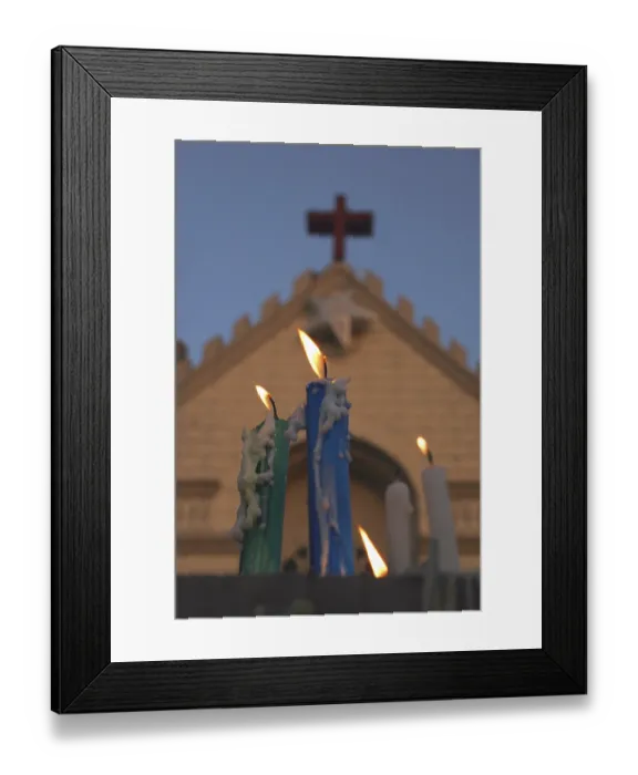 Framed Print : Candles melted burning against St Framed Print : Candles melted burning against St