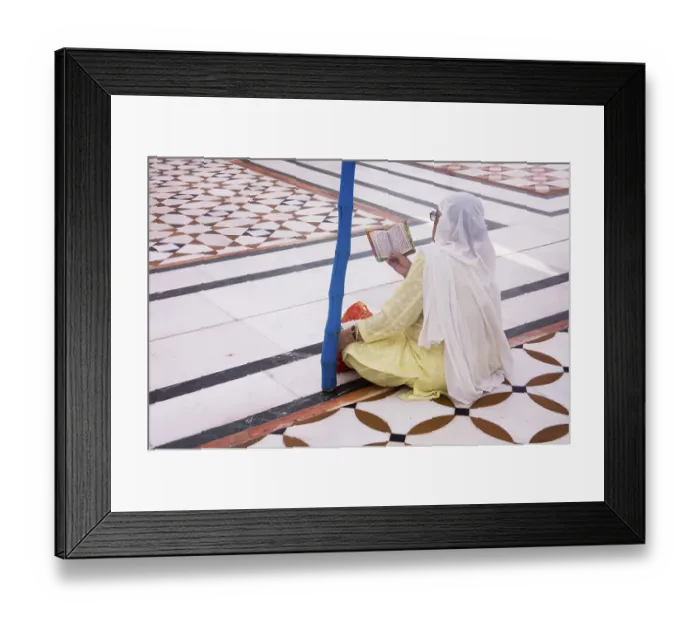 Framed Print : Sikh woman praying sitting on the floral structure pattern of the white marble inside Swarn Mandir Golden temple