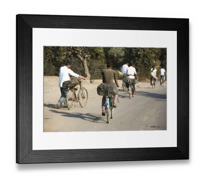 Framed Print : Workers from coal mine carrying lump of coal loaded back seat of bicycles in Jharkhand Framed Print : Workers from coal mine carrying lump of coal loaded back seat of bicycles in Jharkhand