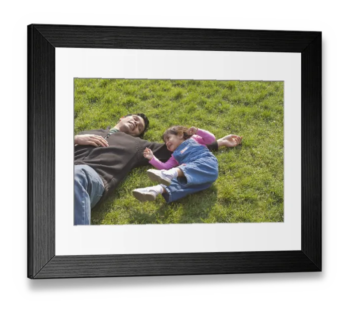 Framed Print : Father and daughter playing and enjoying on green grass at Botanical Garden