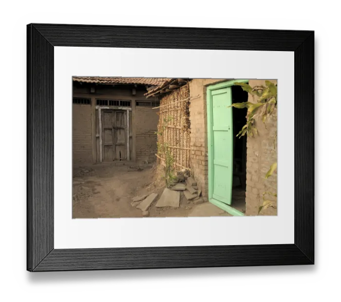 Framed Print : Wooden door of hut with cowdung thatched wall