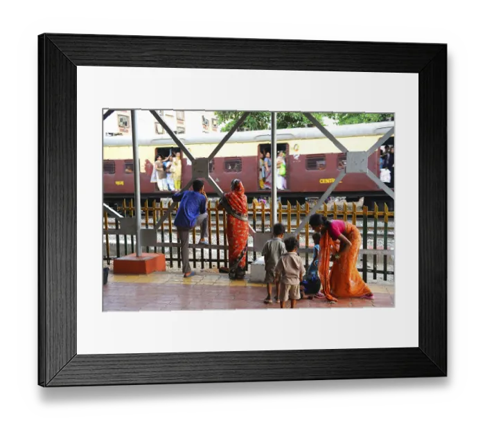 Framed Print : People at station watching train passing