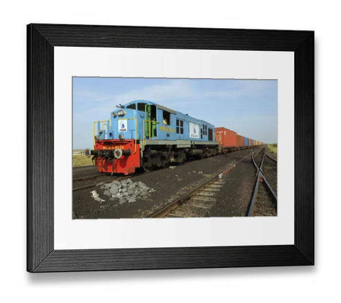 Framed Print : Goods containers with train engine at Adani Power
