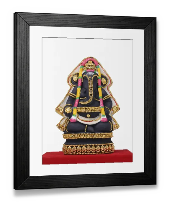 Framed Print : Clay statue of lord ganesh on red cloth