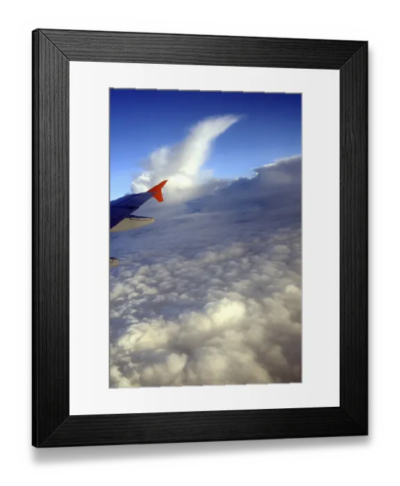 Framed Print : Aerial view of clouds and aircraft wing