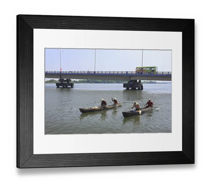Framed Print : Fishing boats moving in water with connecting bridge