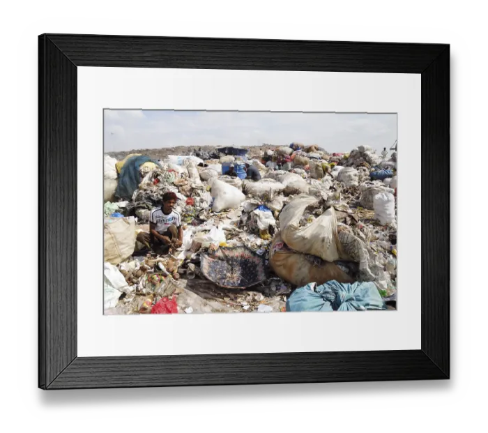 Framed Print : Rag picker collecting garbage in dumping ground
