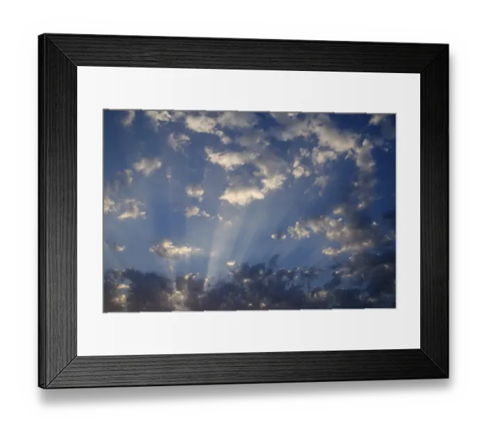 Framed Print : Natural phenomenon of cloud formation and sunrays